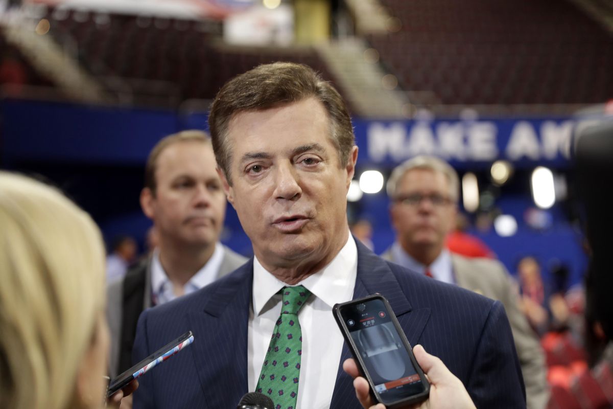 In this July 17, 2016, file photo, then-Donald Trump Campaign Chairman Paul Manafort talks to reporters on the floor of the Republican National Convention in Cleveland. (Matt Rourke / Associated Press)