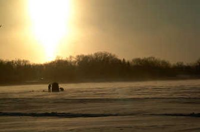 
Fishermen set up their portable fish house  Sunday  after the season's first snowfall in Willmar, Minn. Associated Press
 (Associated Press / The Spokesman-Review)