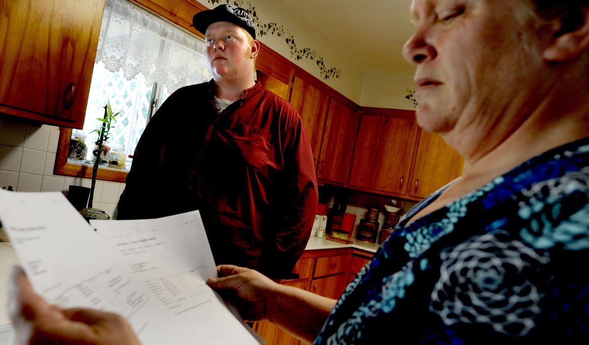Tyler Thompson talks about his grades with his mother, Kristi Thompson, at their home in Sandpoint on Sept. 23. (Kathy Plonka)