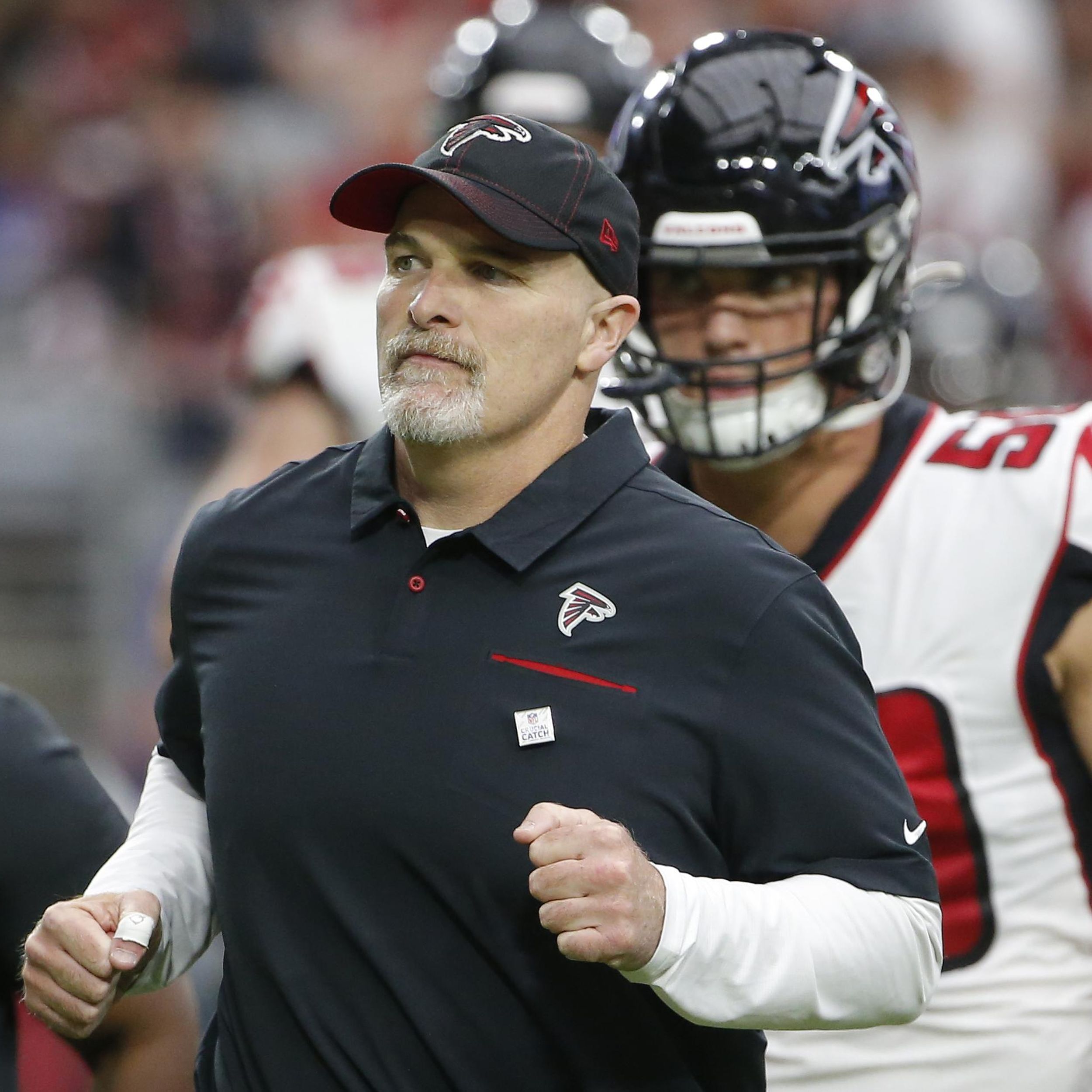 Falcons players standing by Dan Quinn after another gut-wrenching loss