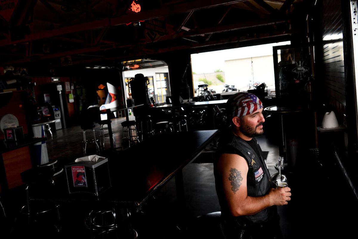 Frank Rollins smiles as he chats with friends during Cruisers Bar & Grill’s Road to Sturgis event on Saturday in Stateline.  (Tyler Tjomsland/THE SPOKESMAN-RE)
