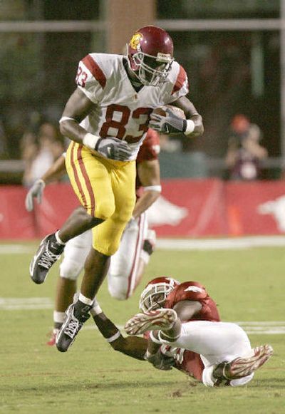 
Arkansas safety Randy Kelly comes up empty while attempting to stop USC tight end Fred Davis. 
 (Associated Press / The Spokesman-Review)
