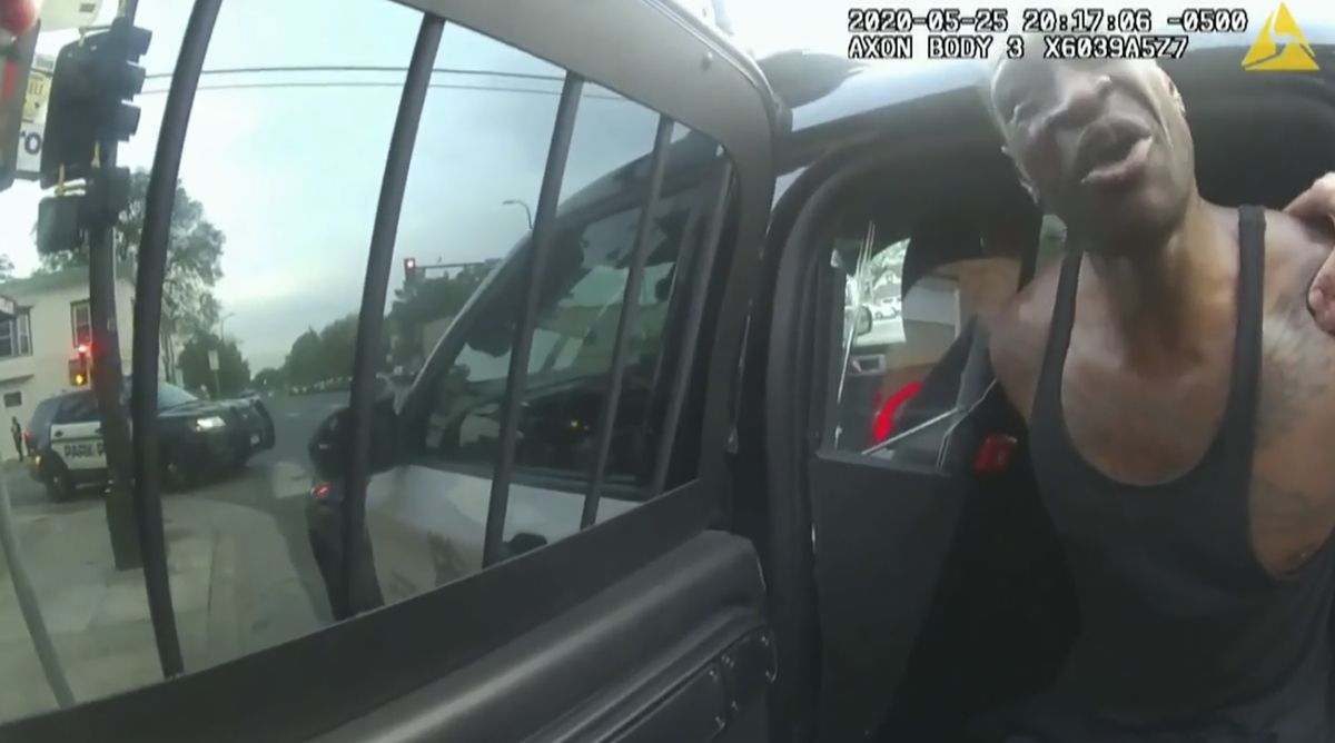 In this image from police body cam video, Minneapolis police officers attempt to place George Floyd in a police vehicle, on May 25, 2020, outside Cup Foods in Minneapolis, as it is shown Wednesday, March 31, 2021, in the trial of former Minneapolis police Officer Derek Chauvin in the death of Floyd, at the Hennepin County Courthouse in Minneapolis.  (POOL)