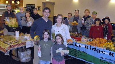Craig Goodwin, wife Nancy, and daughters Noel, 9, and Lily, 6, pose with their friends and vendors at the Millwood Indoor Farmers’ Market. Pictured from left; in back, are Paul Schultz, Schultz Apiaries; Todd Beese and Betsy Mott, The Corner Door Fountain and Books; Jeff Postlewait, The Rocket Bakery; Lois and Tom Tuffin, Arabesque Bread; Dave McCullough, Susie David’s Cattle Co.; Gary and “So” Yi Deuk Angell, Rocky Ridge Ranch; and Joyce Thomas, Thistle Down Wools.  (J. Bart Rayniak / The Spokesman-Review)