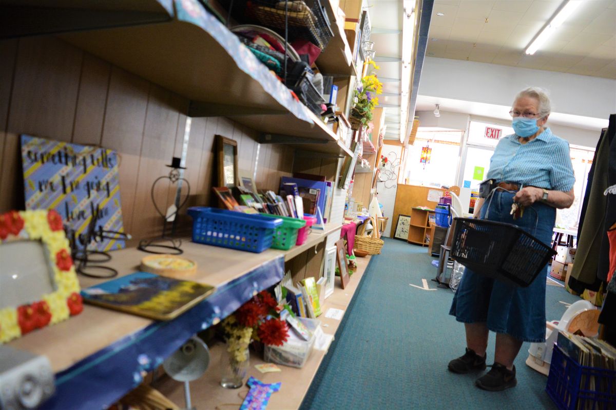 Colfax resident Jerene Shenefelt browses Friday at the Thrifty Grandmothers Shop.  (Greg Mason / The Spokesman-Review)