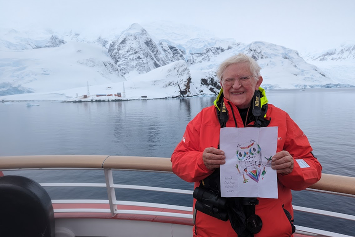Pat Munts holds Flat Owl, the mascot of the Mead School District’s Outdoor School while waiting to go ashore at Paradise Bay on the Antarctic Penninsula.  (Courtesy of Pat Munts)
