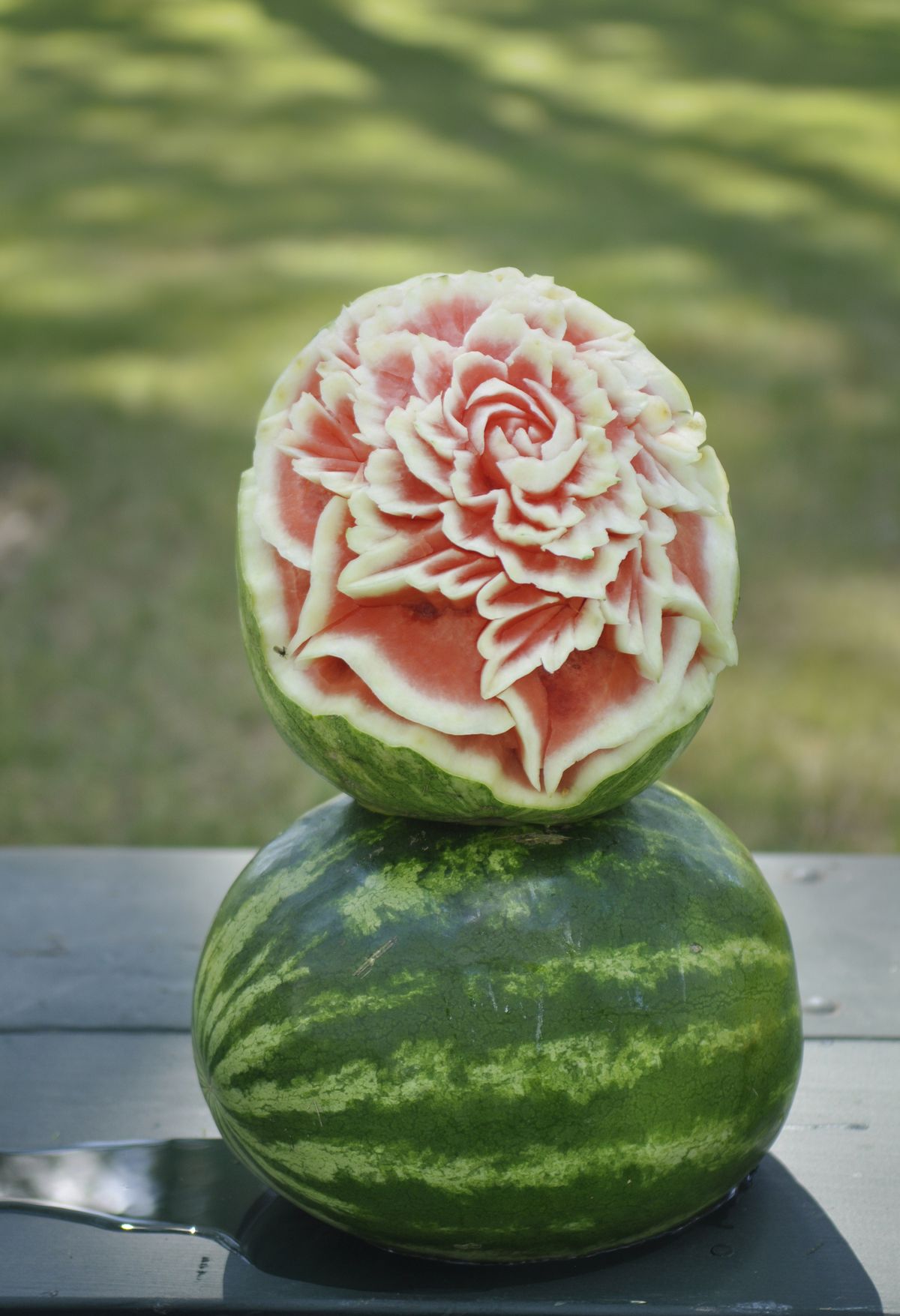 Watermelon carver Ryan Allison is a 2013 graduate of the Spokane Community College culinary program. (Adriana Janovich)