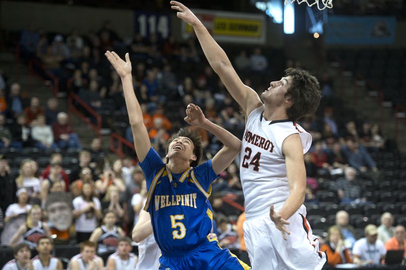Pomeroy's Cody LaMunyan defends against  Wellpinit's James Best, 5, during the 1B Boys Hardwood Classic basketball game, March 6, 2014, in the Spokane Veterans Arena. (Dan Pelle / The Spokesman-Review)