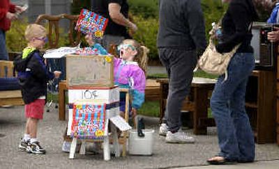 
Everybody is out to make money, including 5-year-old Aylee Anderson as she shouts, 