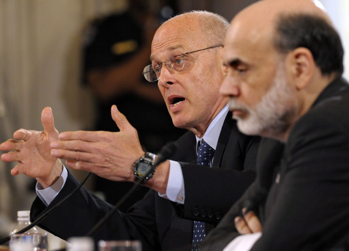 Treasury Secretary Henry Paulson, left, accompanied by Federal Reserve Board Chairman Ben Bernanke, gestures while answering a question during testimony on the economy before the Senate Banking Committee on Tuesday on Capitol Hill.Associated Press photos (Associated Press photos / The Spokesman-Review)