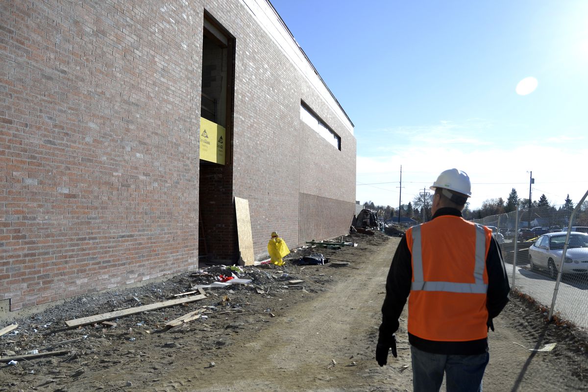 Spokane Public Schools project manager Mike Keenan walks around the new gym and mechanical building at Salk Middle School on Thursday. After the building is done, construction could begin on a new academic building, if a bond passes. (Jesse Tinsley)