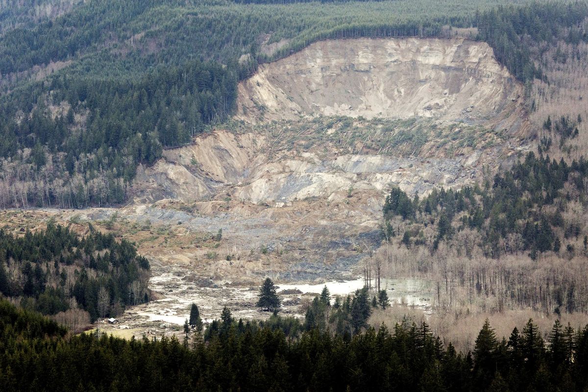 In this aerial photo taken Saturday, a massive mudslide is shown near Oso, Wash. The slide killed at least eight people, and many people are still unaccounted for. (MARCUS YAM)