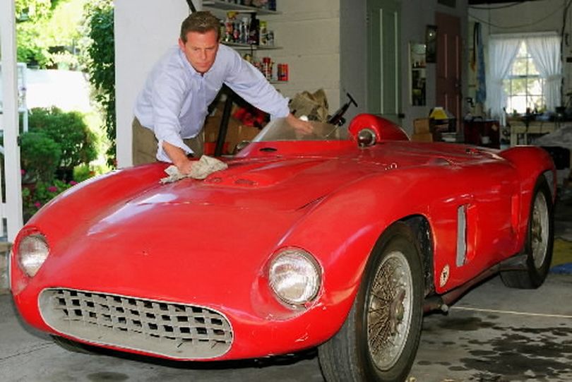 Rick Cole, of Rick Cole Auction Company, polishes a long-lost 1958 Ferrari 500 Testarossa on Monday, Aug. 4, 1997 in Los Angeles.  (AP Photo/HO)