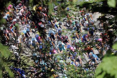 
The pack is seen through the trees during the ascent of the Meraillet pass, during the 8th stage of the 94th Tour de France cycling race between Le Grand Bornand and Tignes, French Alps.Associated Press
 (Associated Press / The Spokesman-Review)