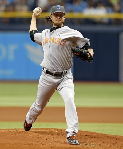 Giants pitcher Jake Peavy is one of several athletes who was caught in a Ponzi-like scheme. (Mike Carlson / Associated Press)