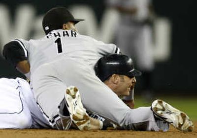 
M's Richie Sexson, top, White Sox' Danny Richar are tangled up in the middle of a double play.  Associated Press
 (Associated Press / The Spokesman-Review)