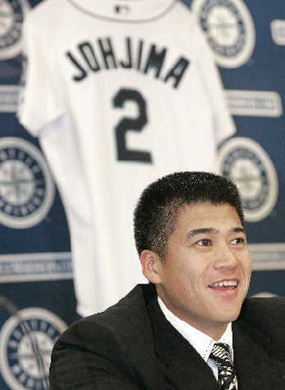 
Kenji Johjima greets the Mariners' media. 
 (Associated Press / The Spokesman-Review)