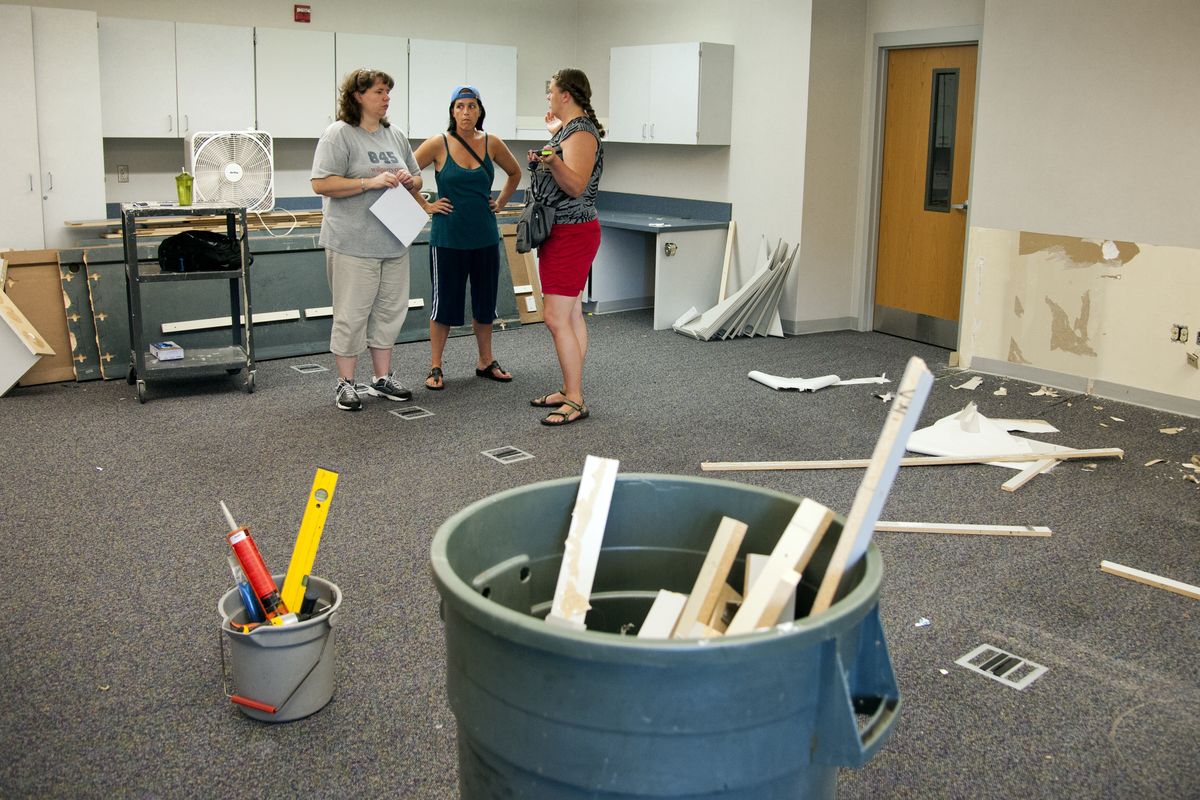Sandra West, Debbie Michaelsen and Kim Gilbert at Adams Elementary School in Spokane Valley inspect their behavioral intervention classroom, where they will be moving into for the start of the school year. (Dan Pelle)