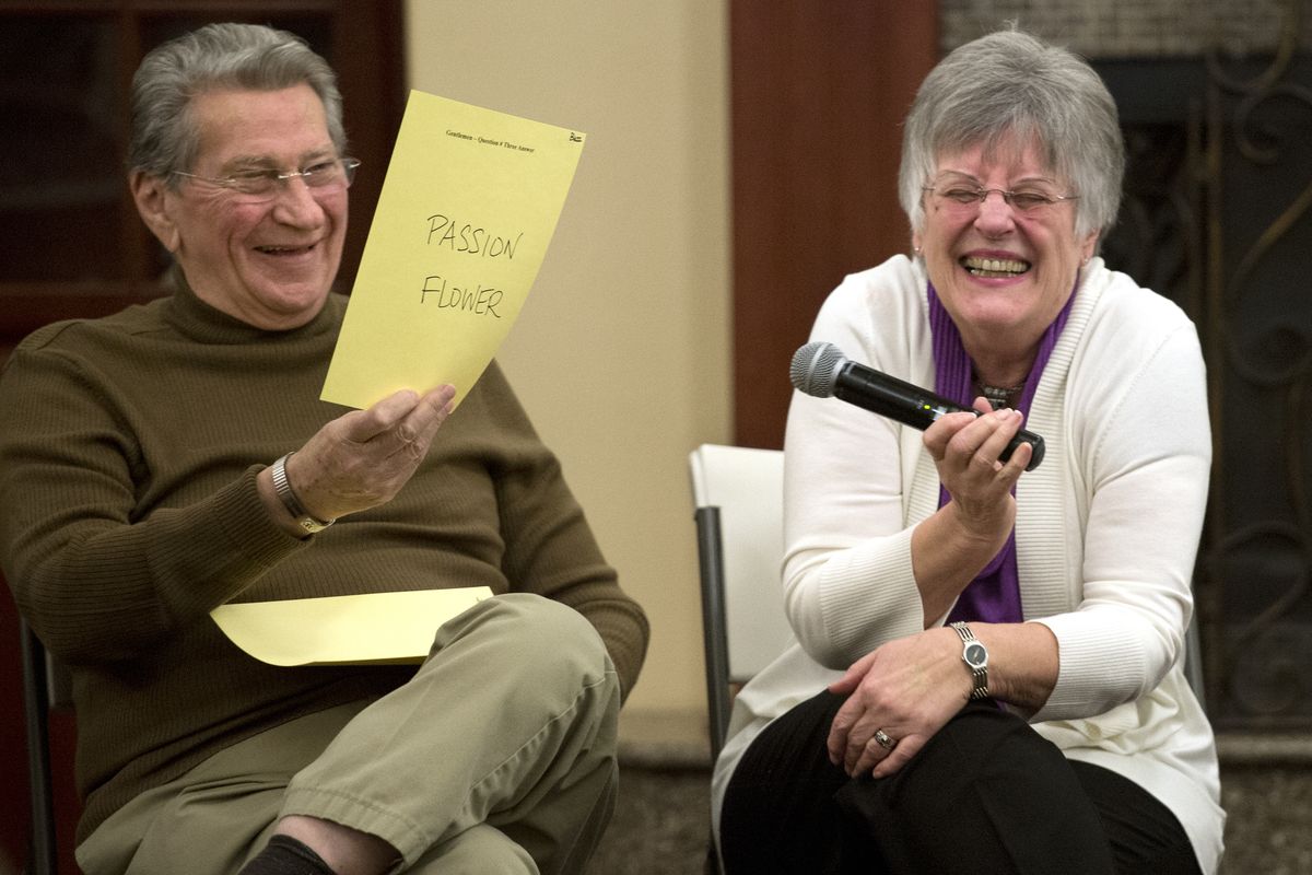 Bernie Rodseth bursts out in laughter as her husband, Buzz, reveals his answer to the question of what flower he thinks his wife would call herself. She said sweet pea, and he said passion flower. The pair were among four couples playing the Not So Newlywed Game on Valentine’s Day at Touchmark on South Hill. (Dan Pelle)