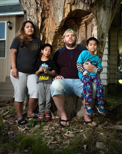 James Hook's wife Emako Loran, on left, lost her job at the Davenport as a housekeeper. He has not been working because his two children, Edward Domingo, 5, on left, and Enzo Domingo,4, have extreme medical issues and he was navigating all of their appointments. They have been dealing with housing insecurity, and have been unable to obtain unemployment assistance. (Colin Mulvany / The Spokesman-Review)