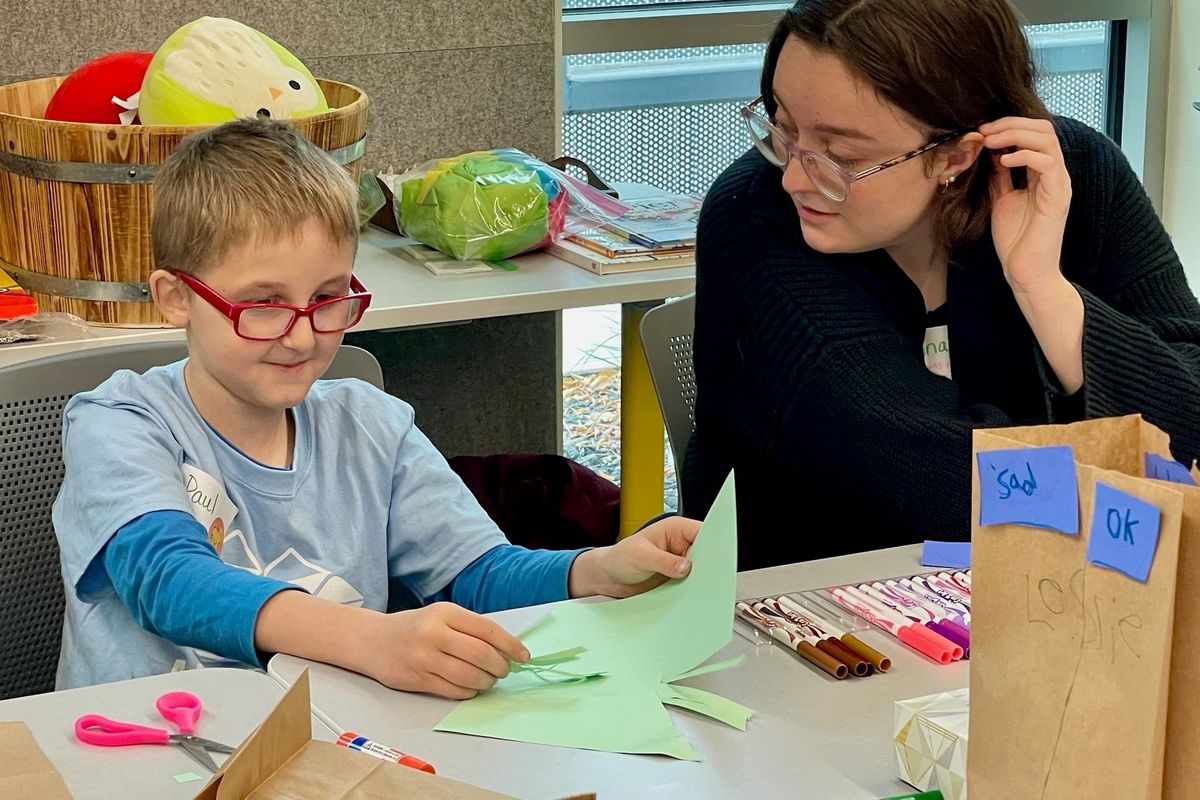 Katrina Doty’s son Paul talks through an activity on feelings at Lion’s Heart.  (Courtesy of Krista Reeder)