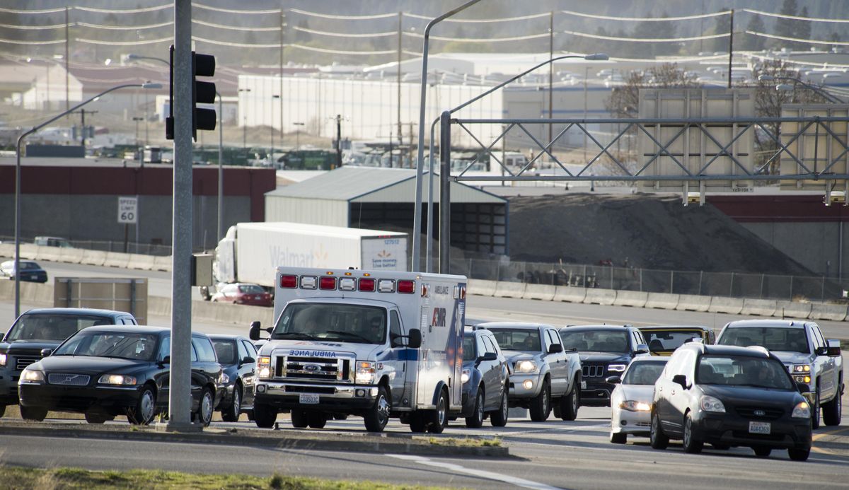 Traffic waits for signal lights to allow them off the Pines offramp from I-90 during afternoon rush hour Tuesday, Mar. 31, 2015. Spokane commuters spend about 15 hours in traffic a year, much better than many other comparably sized cities. (Jesse Tinsley / The Spokesman-Review)