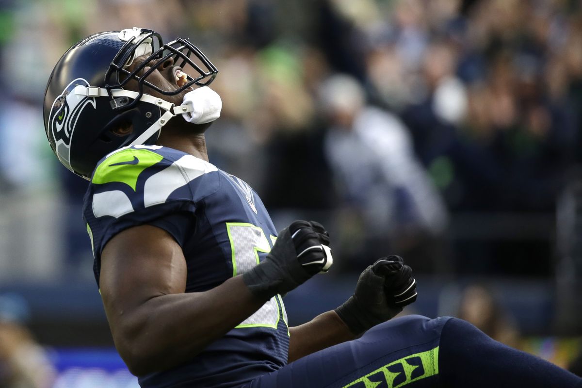 Defensive end Cliff Avril parades after sacking Cardinals quarterback Drew Stanton. Avril had two sacks and three hits on Stanton. (Associated Press)