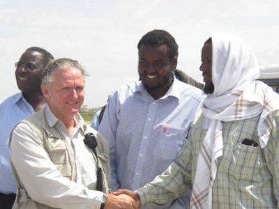 
Joe Gordon, head of  UN Security Somalia,  greets Yusuf Indha'adde, right, one of the officials of the Islamic Courts,  at the Mogadishu airport Monday  while assessing security conditions for  aid agencies.
 (Associated Press / The Spokesman-Review)