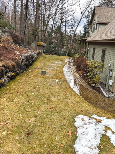 This ponding water in front of the house foundation can cause many problems. There’s an easy way to prevent it.  (Tribune Content Agency)
