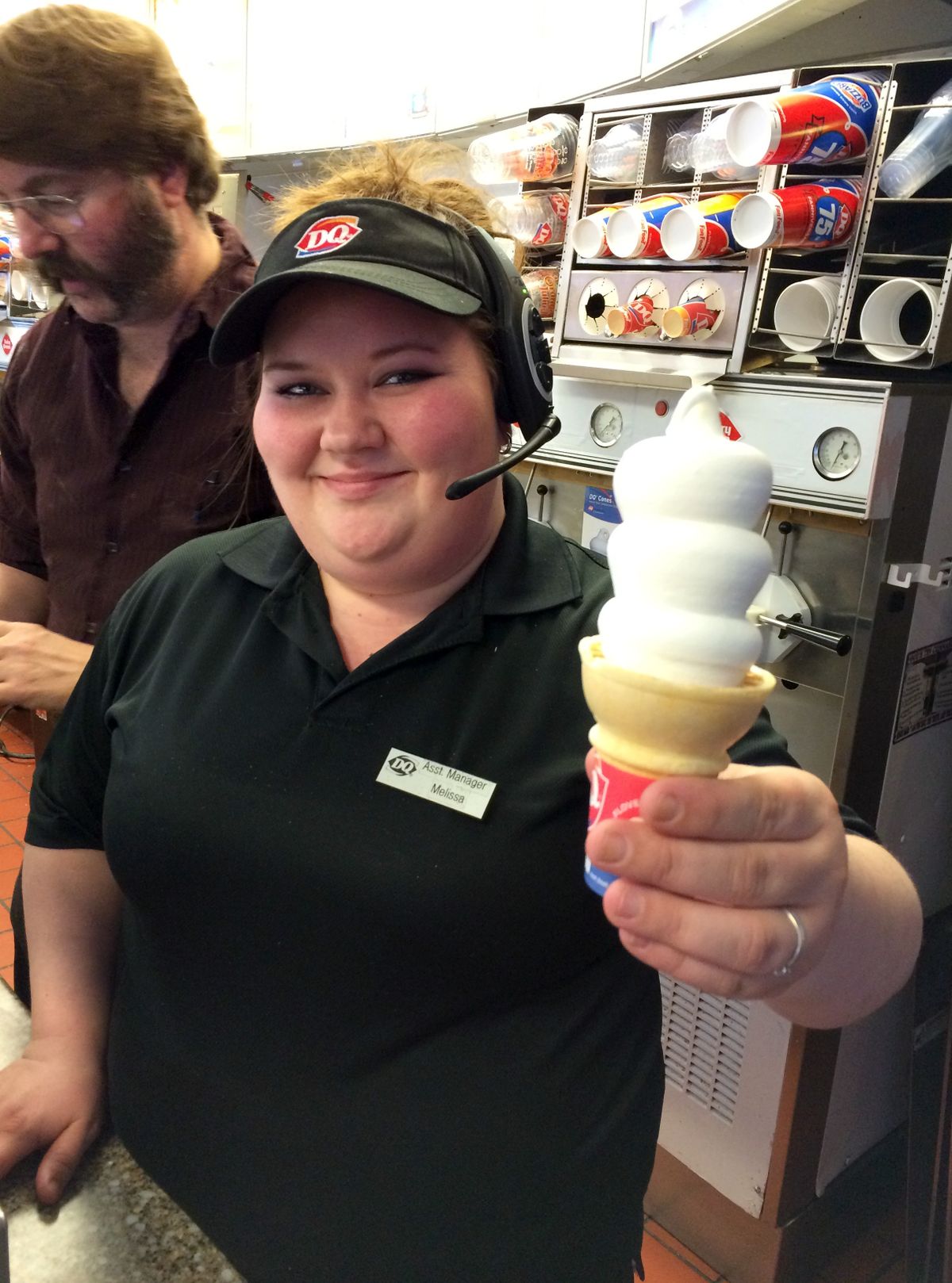 Melissa Young, assistant manager of the Coeur d’Alene Dairy Queen, hands me my first free cone. (Doug Clark)