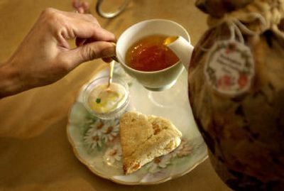 
A cup of tea goes well with a warm scone and cream.
 (The Spokesman-Review)