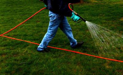 
A Bestway Fuel and Spray specialist treats a Spokane lawn with a spring fertilizer earlier this year. 
 (Brian Plonka / The Spokesman-Review)