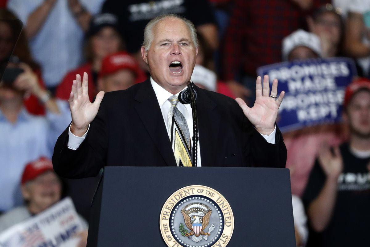 This Nov. 5, 2018 photo shows radio personality Rush Limbaugh introducing President Donald Trump at the start of a campaign rally in Cape Girardeau, Mo. Limbaugh, the talk radio host who became the voice of American conservatism, has died.  (Jeff Roberson/Associated Press)