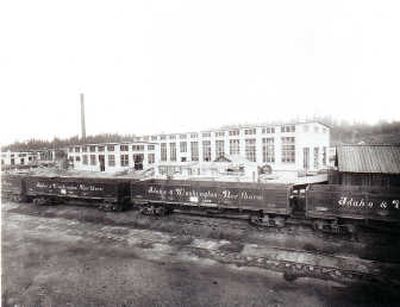 
A portion of the I&WN railroad shop complex at Spirit Lake, Idaho, in 1908. The huge building in the rear was the machine shop. The smaller building with the stack included the foundry and sheet metal shop. A small bit of the unfinished roundhouse shows in the distance. Courtesy of the Museum of North Idaho
 (Courtesy of the Museum of North Idaho / The Spokesman-Review)