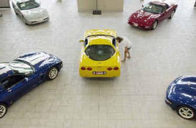 
Kathy Prasch looks at a Corvette in the showroom of Husker Auto in Lincoln, Neb., earlier this week.
 (Associated Press / The Spokesman-Review)