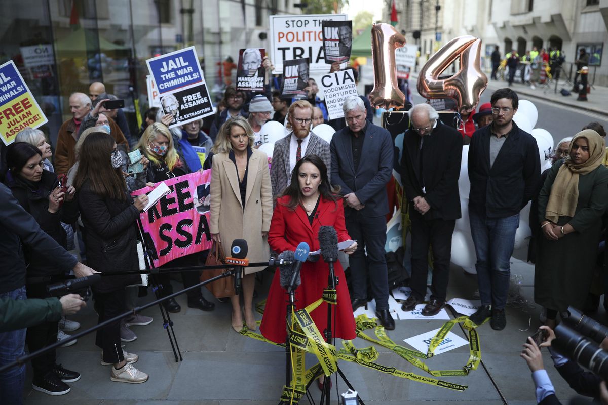 Stella Moris, partner of Julian Assange gives a statement outside the Old Bailey in London, Thursday, Oct. 1, 2020, as the Assange extradition hearing to the US has ended, with a result expected later in the year.  (Yui Mok)