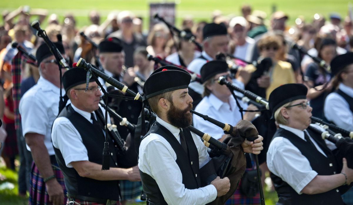 Bagpipers perform during the opening ceremony of Spokane Scottish Highland Games on Saturday, August 3, 2019 at the Spokane County Fairgrounds. (Kathy Plonka / The Spokesman-Review)