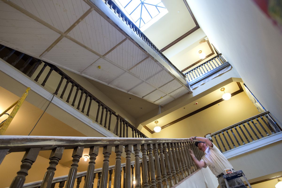 Shawn Curtis restores a staircase in the historic Germond Block on Wednesday in Spokane. (Tyler Tjomsland)
