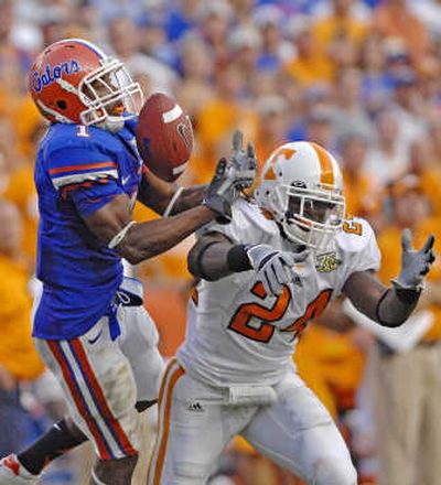 
Florida  receiver Percy Harvin pulls in a long fourth-quarter pass in front of Tennessee's DeAngelo Willingham. Associated Press
 (Associated Press / The Spokesman-Review)
