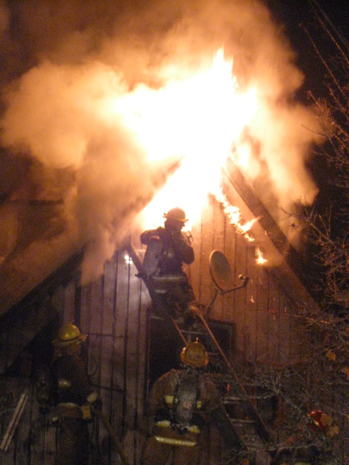 A chimney fire ripped through the roof of the home at 8407 E. Knox Ave. just after 4 a.m. on Oct. 28, 2009, displacing three adults and two children and causing more than $200,000 in damage.  (Spokane Valley Fire Department)