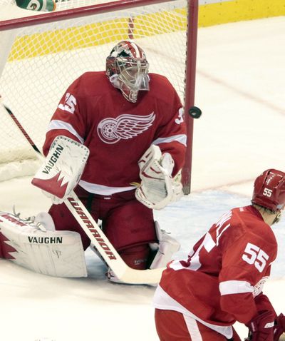 Detroit Red Wings goaltender Jimmy Howard makes a stop during the second period Thursday against Vancouver. (Associated Press)