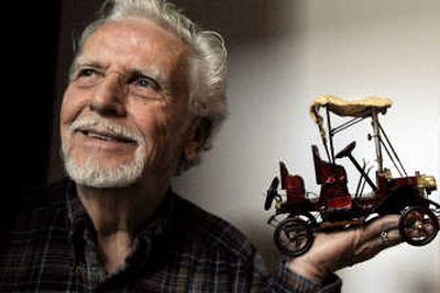 
Monte Gould of Coeur d'Alene talked about the model size 1911 Buick that he made as part of his collection of model cars. 
 (Kathy Plonka / The Spokesman-Review)