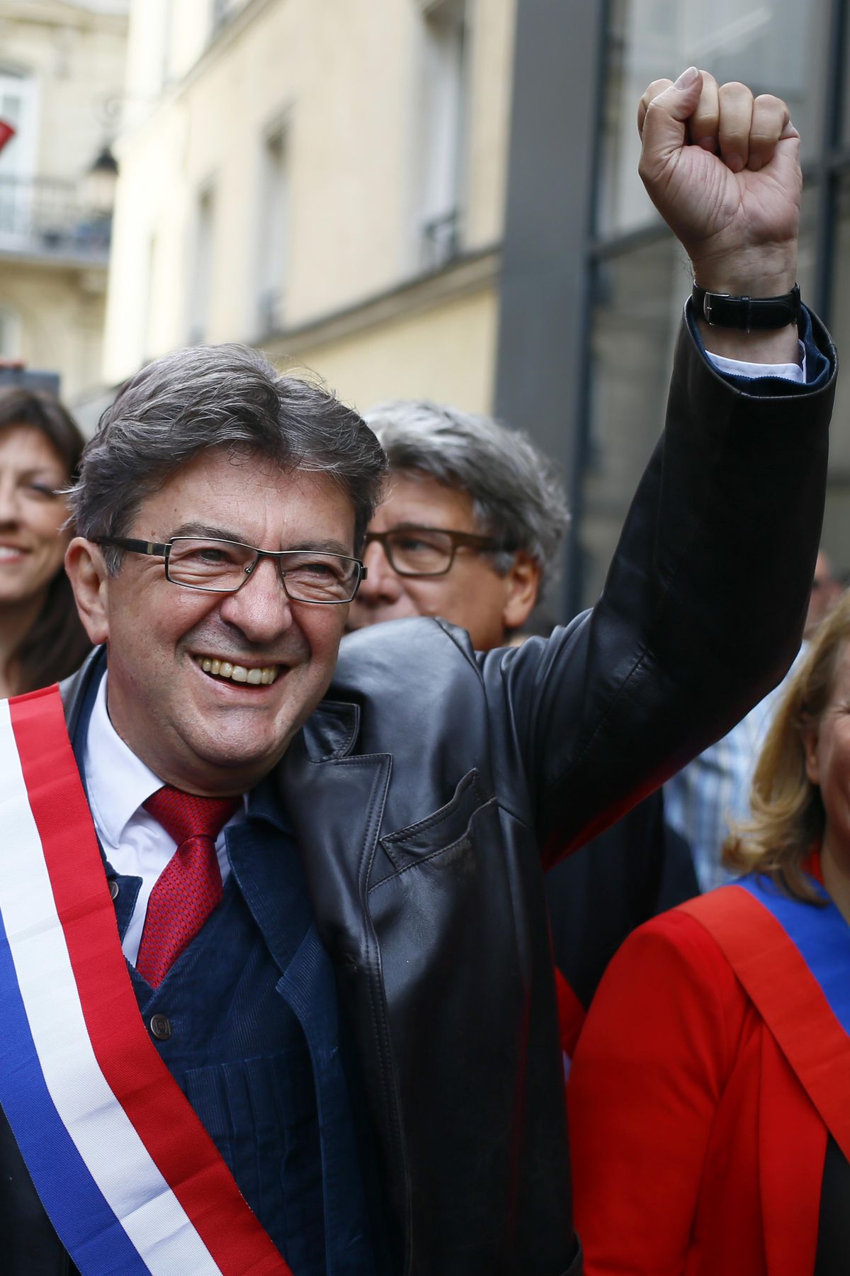 French far-left leader Jean-Luc Melenchon greets supporters as he arrives to take part in a demonstration in Paris, France, Saturday, Sept. 23, 2017. Melenchon is rallying disaffected voters against President Emmanuel Macron’s proposals to reduce worker protections, amid spreading discontent with his presidency and his vision for a more market-friendly economy. (Francois Mori / Associated Press)