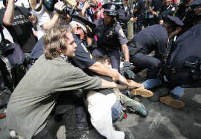 
Police and demonstrators scuffle outside the Fleet Center in Boston on Thursday prior to concluding events at the Democratic National Convention. 
 (Associated Press / The Spokesman-Review)