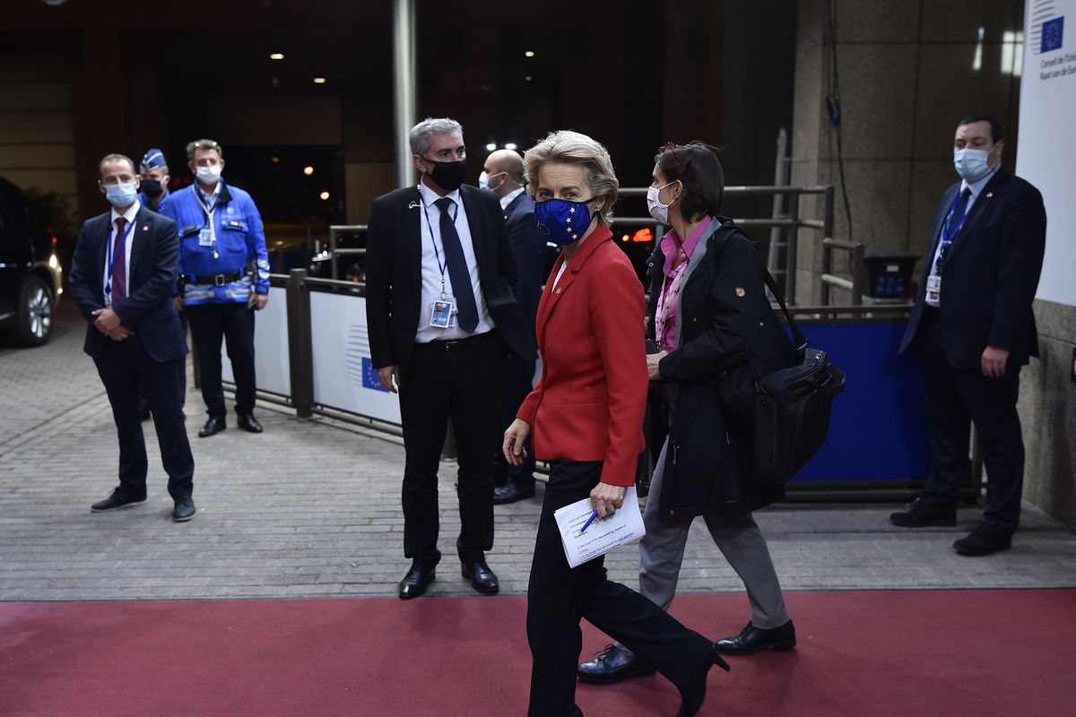 European Commission President Ursula von der Leyen, center, departs an EU summit at the European Council building in Brussels, Friday, Oct. 2, 2020. European Union leaders met to address a series of foreign affairs issues ranging from Belarus to Turkey and tensions in the eastern Mediterranean.  (John Thys)