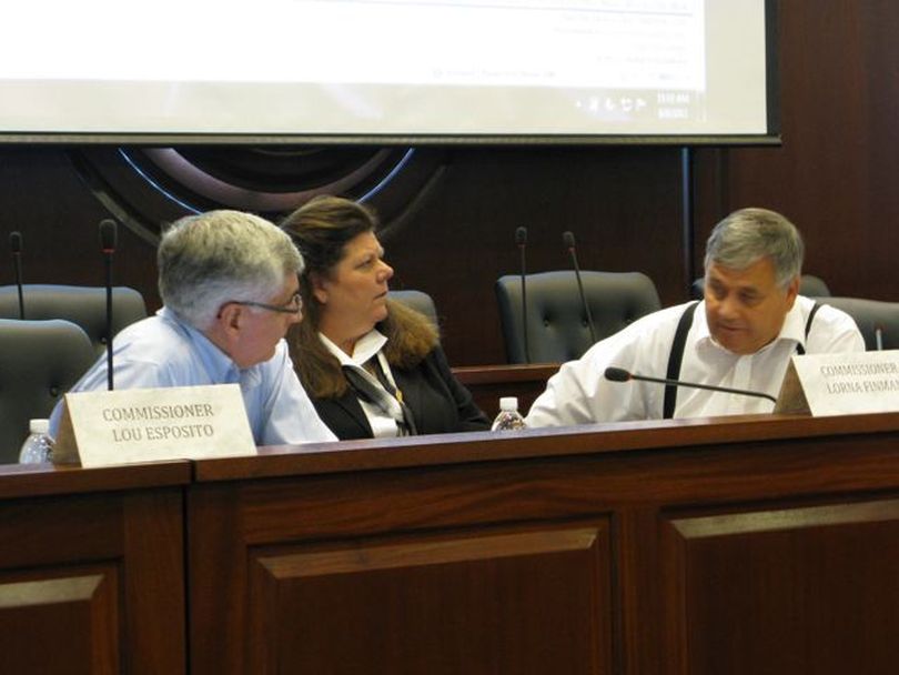 GOP redistricting commissioners Lou Esposito, Lorna Finman and Evan Frasure confer on Tuesday (Betsy Russell)