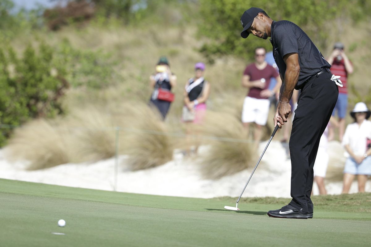 Tiger Woods putts on the first hole during the first round at the Hero World Challenge golf tournament, Thursday, Dec. 1, 2016, in Nassau, Bahamas. (Lynne Sladky / Associated Press)