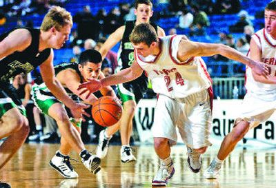 
Ferris forward Jared Karstetter, right, tries for a steal from Kentwood Conqueror Vance Roush during the Saxons' win. 
 (Holly Pickett / The Spokesman-Review)