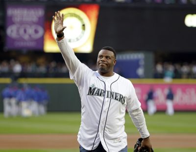 Former Seattle Mariners outfielder Ken Griffey Jr. waves to fans after being introduced before a baseball game against the Texas Rangers Friday, April 14, 2017, in Seattle. (Elaine Thompson / AP Photo)