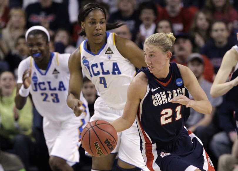 Gonzaga's Courtney Vandersloot (21) is chased by UCLA's Markel Walker (23) and Christina Nzekwe (4) as she races upcourt during the first half of their second-round game of the NCAA women's college basketball tournament Monday, March 21, 2011, in Spokane, Wash. (Elaine Thompson / Associated Press)